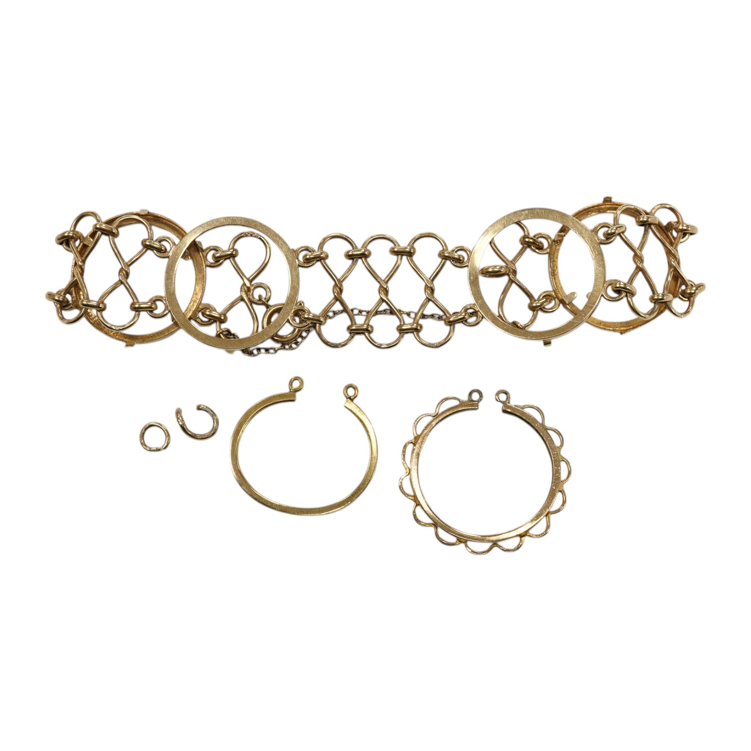 A 9ct gold coin bracelet (now lacking coins), one other 9ct gold coin mount and a similar yellow metal mount, gross weight 13.4 grams. Condition - poor to fair